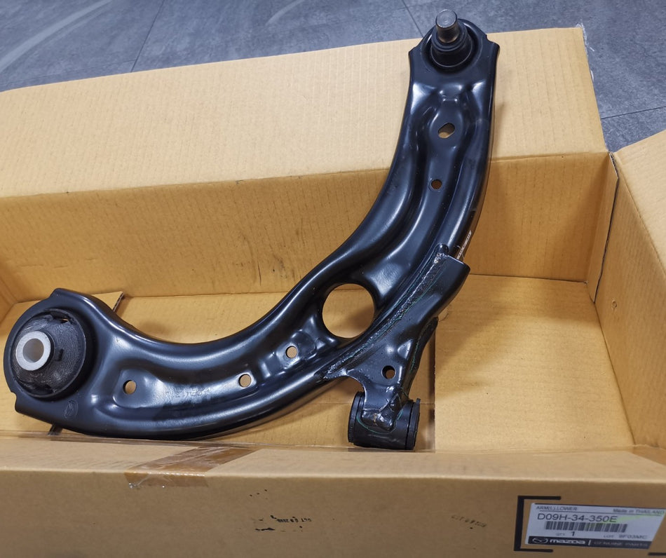 D09H34350E Lower Arm LH Mazda Genuine